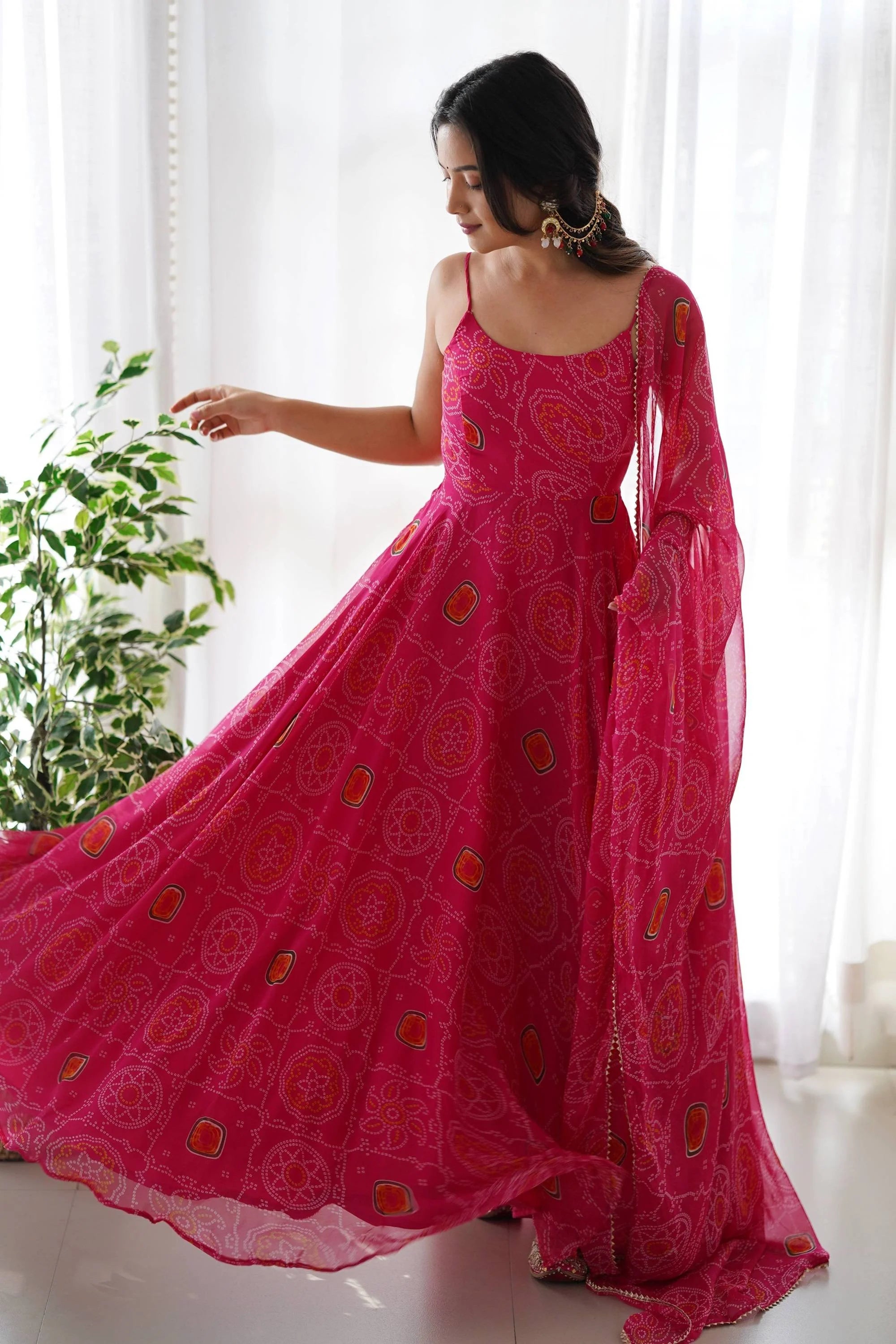 Flaunt Your Style with our Ready-to-Wear Pink Bandhej Print Chiffon Gown