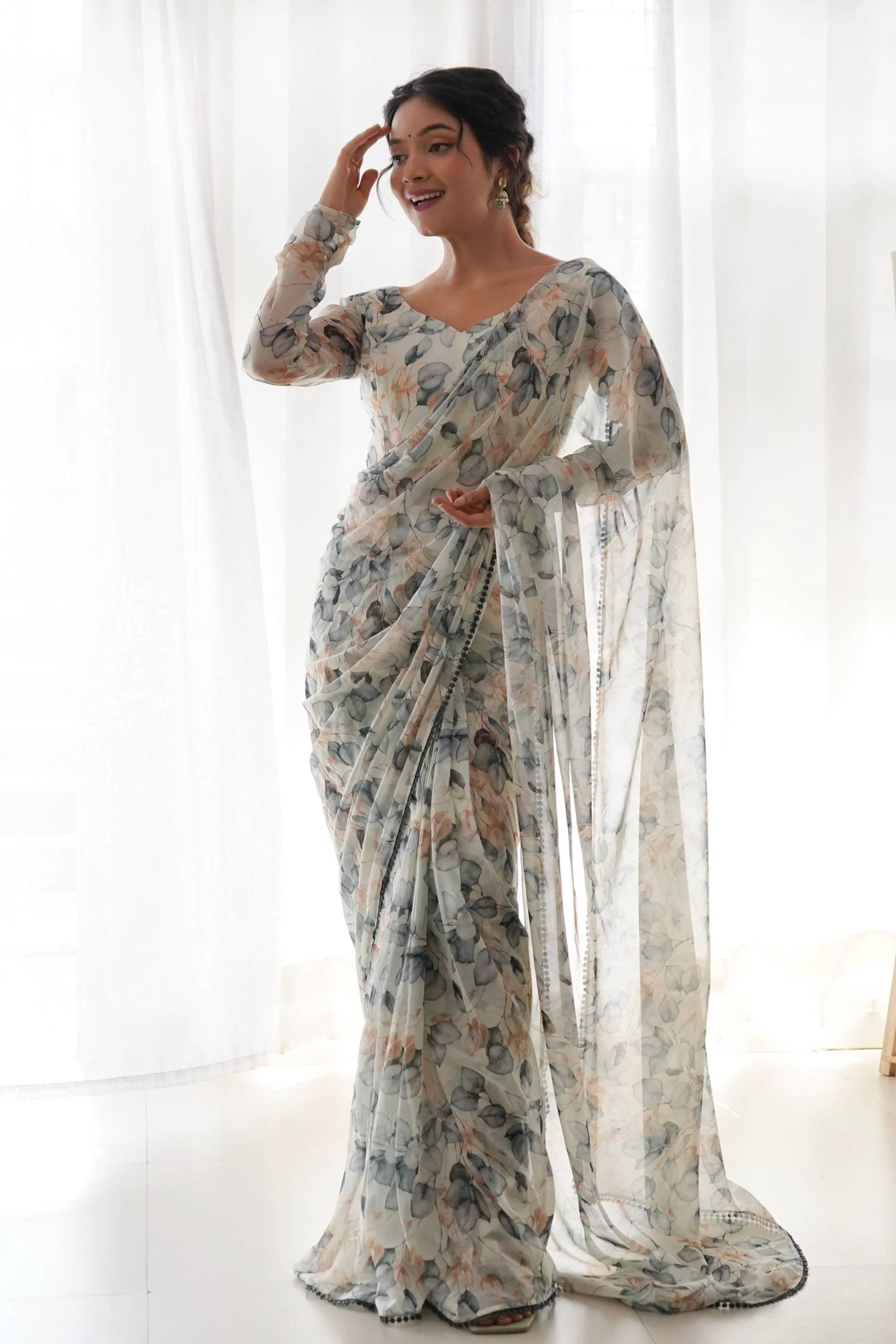 Step Up Your Style Game with This Gorgeous Cream Leaf Print Chiffon Saree